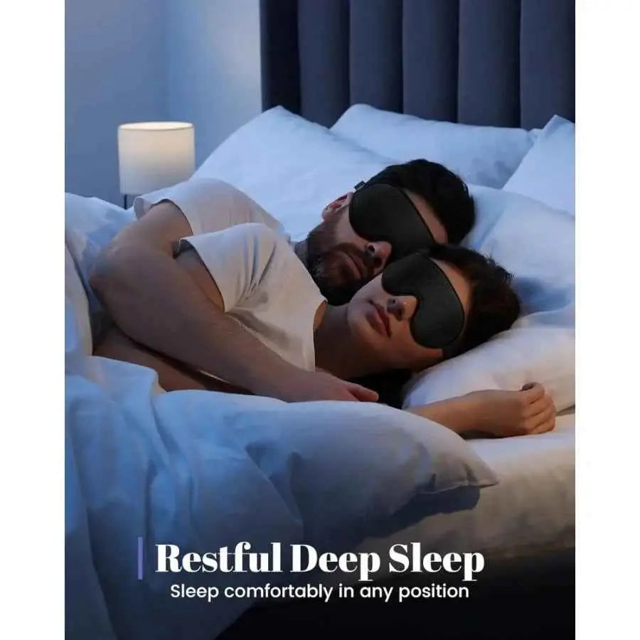 Couple wearing black 3D sleep eye masks in bed, showcasing restful deep sleep and comfort in any sleeping position.